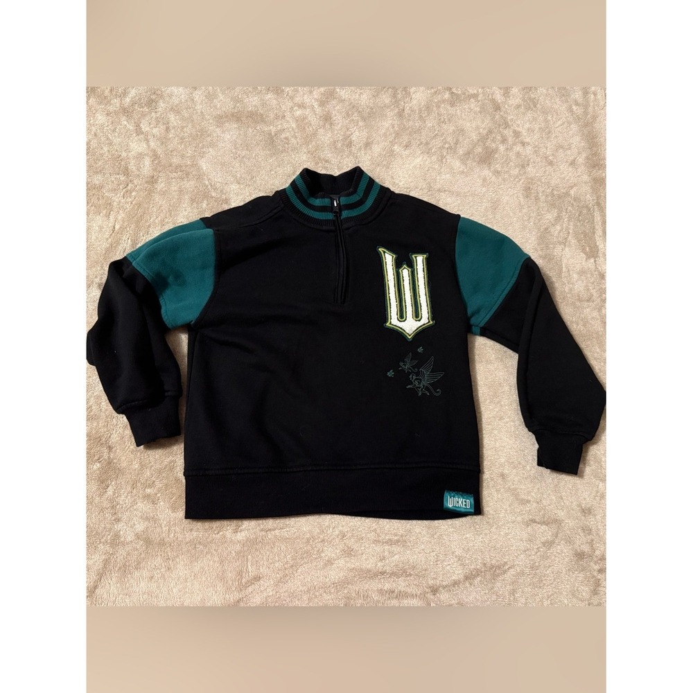 Wicked Movie Paul Tazewell Kids Quarter Zip Sweatshirt Black Green Medium Patch